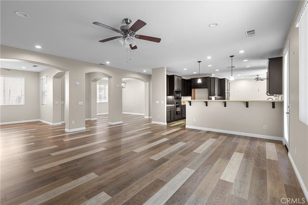 Empty room, Interior, Kitchen, Pendant Lights, Recessed Lighting, Stainless Steel Appliances, Wood Texture Flooring