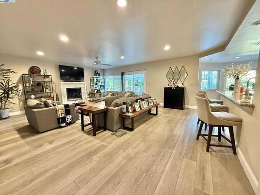 Dining room, Fireplace, Interior, Living room, Recessed Lighting, Wood Texture Flooring
