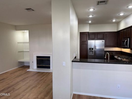Fireplace, Interior, Kitchen, Recessed Lighting, Wood Texture Flooring