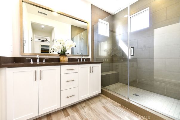 Bathroom, Dual Sink Vanities, Glass Shower, Interior, Recessed Lighting, Wood Texture Flooring