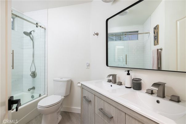 Bathroom, Dual Sink Vanities, Glass Shower, Interior, Wood Texture Flooring
