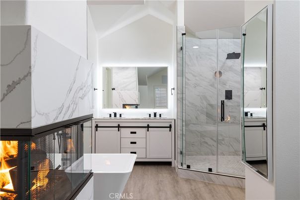 Bathroom, Fireplace, Glass Shower, Interior, Marble Walls, Wood Texture Flooring