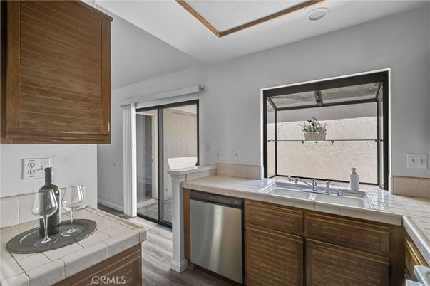 Interior, Kitchen, Stainless Steel Appliances, Tile Countertops, Wood Texture Flooring