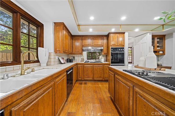 Interior, Kitchen, Recessed Lighting, Tile Countertops, Wood Texture Flooring