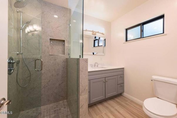 Bathroom, Glass Shower, Interior, Marble Walls, Wood Texture Flooring