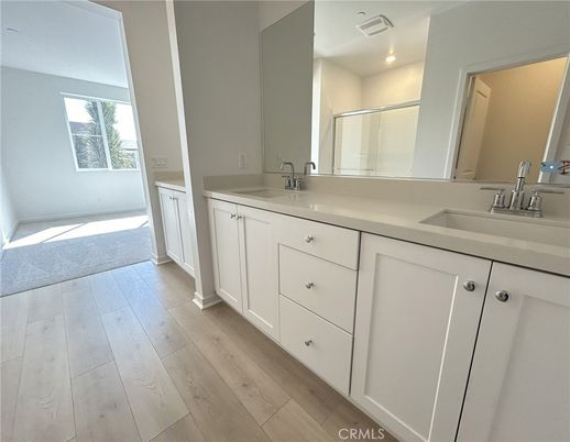 Bathroom, Dual Sink Vanities, Interior, Recessed Lighting, Wood Texture Flooring