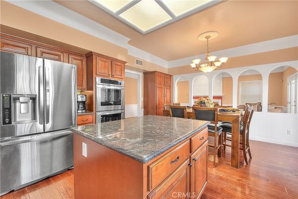 Chandelier, Dining room, Interior, Kitchen, Stainless Steel Appliances, Wood Texture Flooring