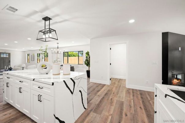 Chandelier, Dining room, Fireplace, Interior, Kitchen, Pendant Lights, Recessed Lighting, Wood Texture Flooring