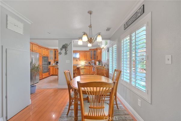 Chandelier, Dining room, Interior, Kitchen, Stainless Steel Appliances, Wood Texture Flooring