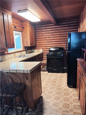 Interior, Kitchen, Tile Countertops, Wooden Walls