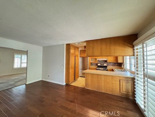 Empty room, Interior, Kitchen, Stainless Steel Appliances, Wood Texture Flooring