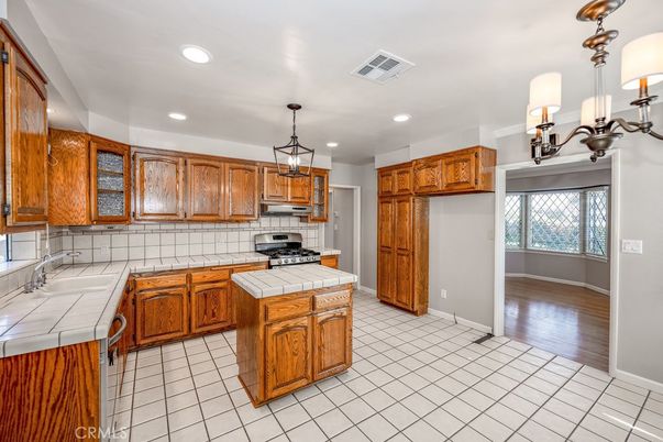 Interior, Kitchen, Pendant Lights, Recessed Lighting, Tile Countertops, Wood Texture Flooring