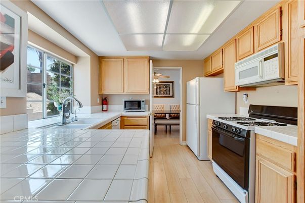 Interior, Kitchen, Tile Countertops, Wood Texture Flooring
