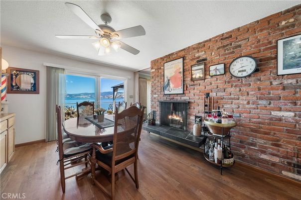Dining room, Fireplace, Interior, Stone Walls, Water, Wood Texture Flooring