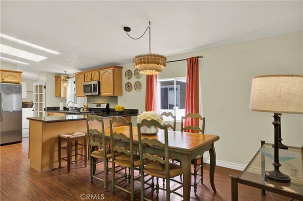 Chandelier, Dining room, Interior, Kitchen, Pendant Lights, Stainless Steel Appliances, Wood Texture Flooring