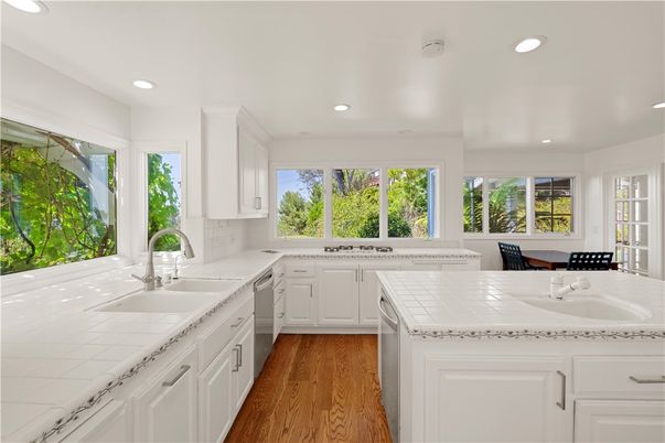 Interior, Kitchen, Recessed Lighting, Tile Countertops, Wood Texture Flooring