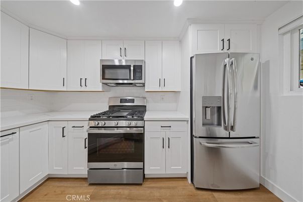 Interior, Kitchen, Recessed Lighting, Stainless Steel Appliances, Wood Texture Flooring