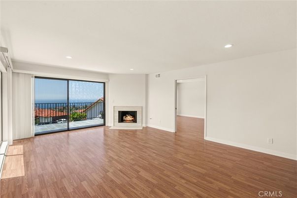 Empty room, Fireplace, Interior, Recessed Lighting, Water, Wood Texture Flooring
