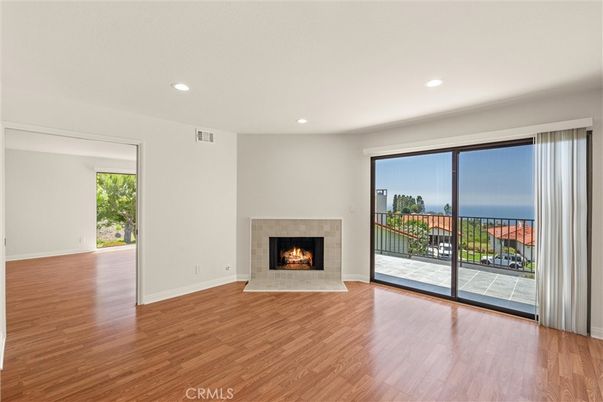 Empty room, Fireplace, Interior, Recessed Lighting, Water, Wood Texture Flooring
