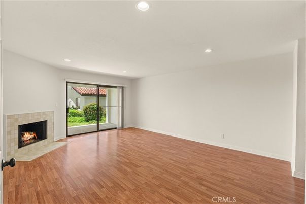 Empty room, Fireplace, Interior, Recessed Lighting, Wood Texture Flooring