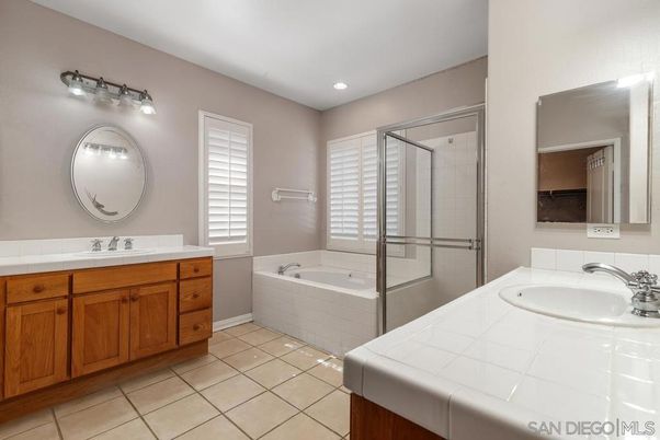 Bathroom, Dual Sink Vanities, Glass Shower, Interior, Recessed Lighting, Tile Countertops