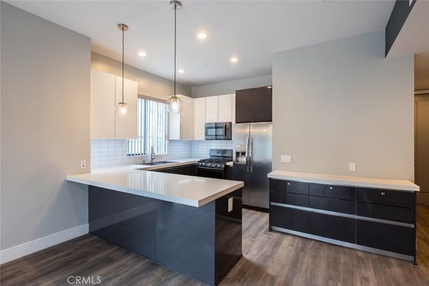 Interior, Kitchen, Pendant Lights, Recessed Lighting, Stainless Steel Appliances, Wood Texture Flooring