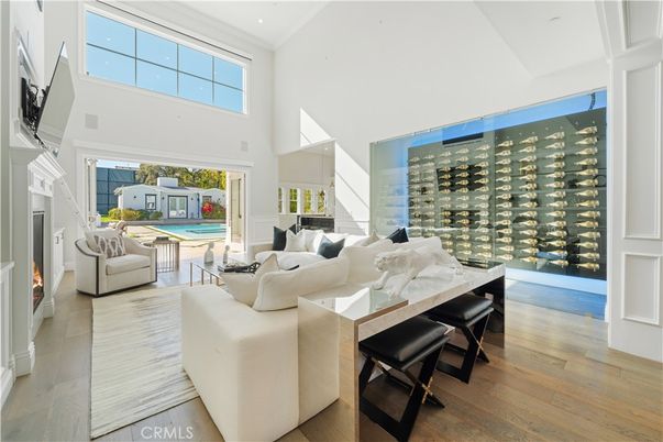 Fireplace, Interior, Living room, Recessed Lighting, Wine Storage, Wood Texture Flooring