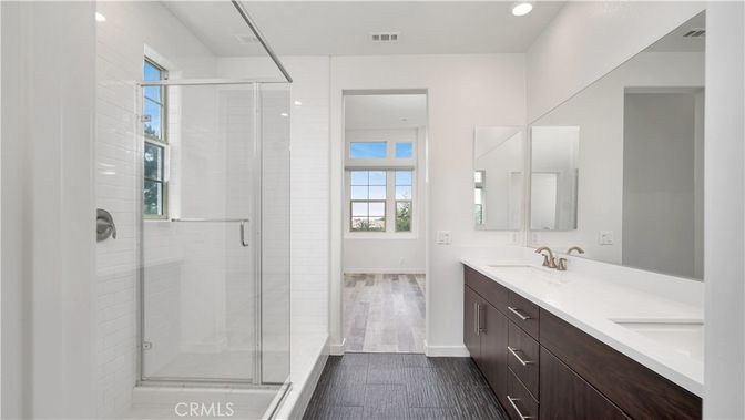 Bathroom, Dual Sink Vanities, Glass Shower, Interior, Recessed Lighting, Wood Texture Flooring