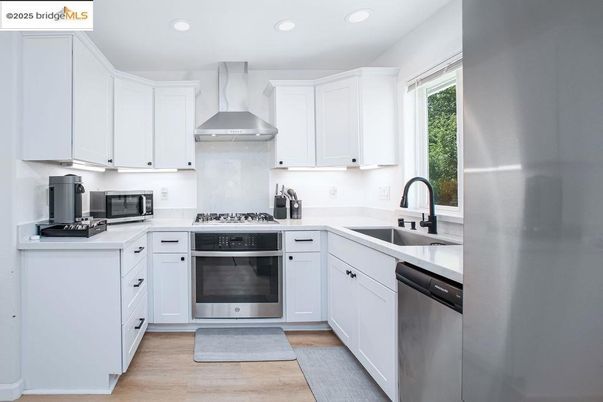Interior, Kitchen, Recessed Lighting, Stainless Steel Appliances, Wood Texture Flooring