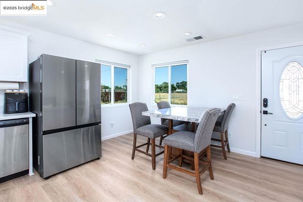 Dining room, Interior, Kitchen, Recessed Lighting, Stainless Steel Appliances, Wood Texture Flooring