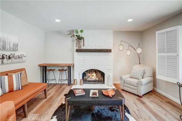 Fireplace, Interior, Living room, Recessed Lighting, Stone Walls, Wood Texture Flooring