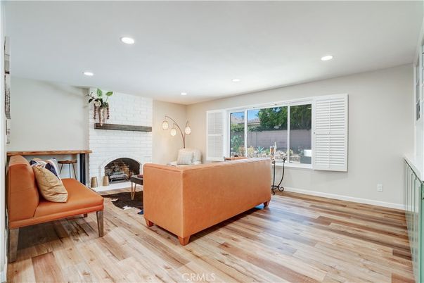 Fireplace, Interior, Living room, Recessed Lighting, Stone Walls, Wood Texture Flooring