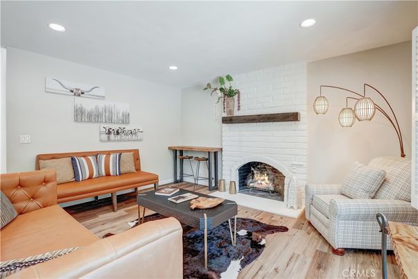 Fireplace, Interior, Living room, Pendant Lights, Recessed Lighting, Stone Walls, Wood Texture Flooring
