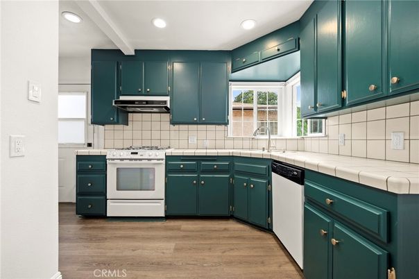Interior, Kitchen, Recessed Lighting, Tile Countertops, Wood Texture Flooring
