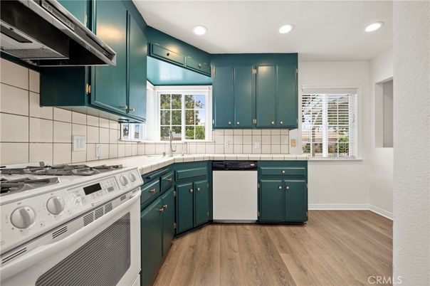 Interior, Kitchen, Recessed Lighting, Tile Countertops, Wood Texture Flooring