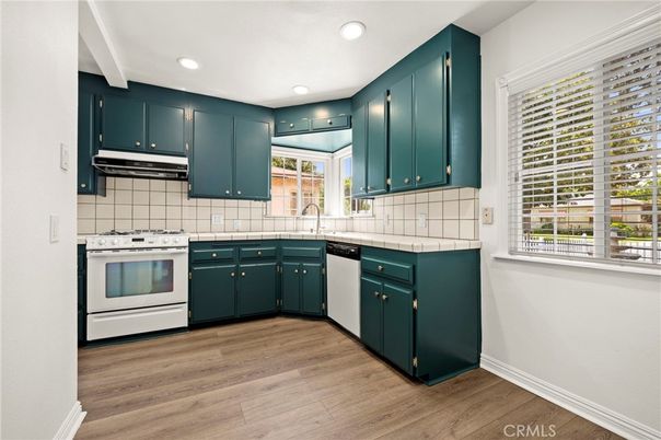 Interior, Kitchen, Recessed Lighting, Tile Countertops, Wood Texture Flooring