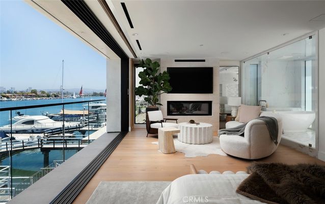 Fireplace, Interior, Living room, Recessed Lighting, Water, Wood Texture Flooring