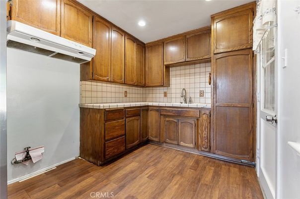 Interior, Kitchen, Recessed Lighting, Tile Countertops, Wood Texture Flooring