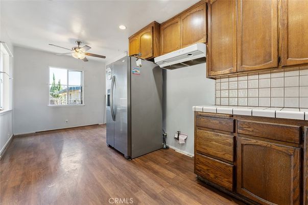 Interior, Kitchen, Recessed Lighting, Tile Countertops, Wood Texture Flooring