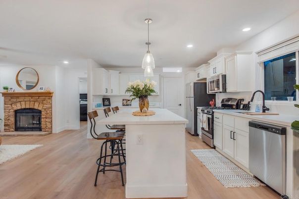 Fireplace, Interior, Kitchen, Pendant Lights, Recessed Lighting, Stainless Steel Appliances, Wood Texture Flooring