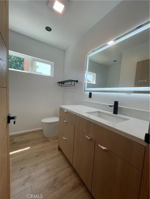 Bathroom, Dual Sink Vanities, Interior, Recessed Lighting, Wood Texture Flooring