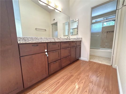 Bathroom, Dual Sink Vanities, Glass Shower, Interior, Wood Texture Flooring