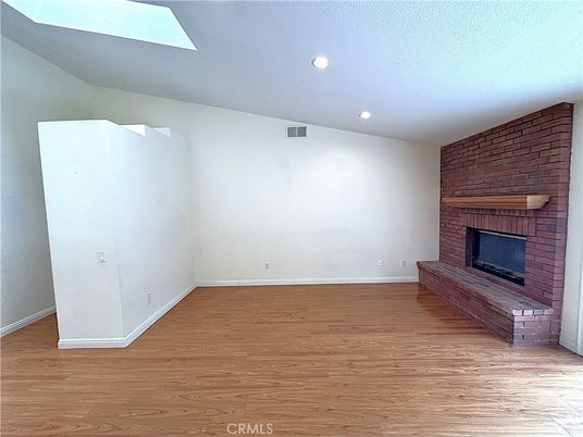 Empty room, Fireplace, Interior, Recessed Lighting, Stone Walls, Wood Texture Flooring, Wooden Walls