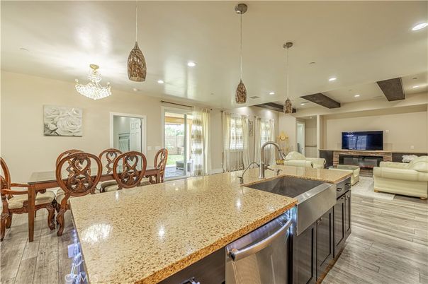 Chandelier, Dining room, Fireplace, Interior, Kitchen, Living room, Pendant Lights, Recessed Lighting, Wood Texture Flooring