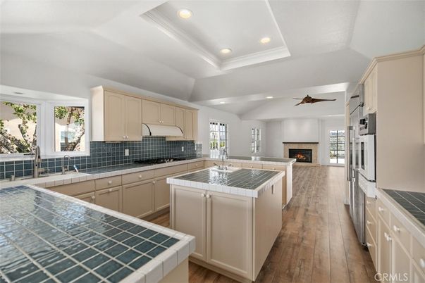 Fireplace, Interior, Kitchen, Recessed Lighting, Tile Countertops, Wood Texture Flooring