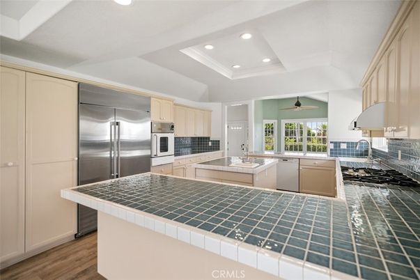 Interior, Kitchen, Recessed Lighting, Stainless Steel Appliances, Tile Countertops, Wood Texture Flooring