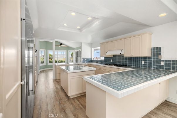 Interior, Kitchen, Recessed Lighting, Tile Countertops, Wood Texture Flooring