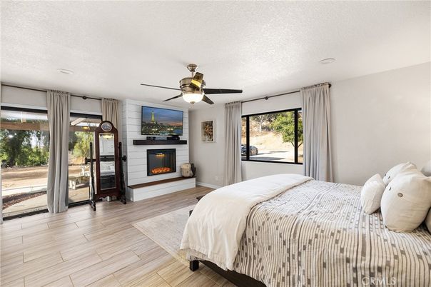 Bedroom, Fireplace, Interior, Recessed Lighting, Wood Texture Flooring