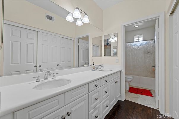 Bathroom, Dual Sink Vanities, Glass Shower, Interior, Recessed Lighting, Wood Texture Flooring