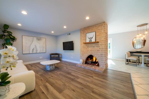 Dining room, Fireplace, Interior, Pendant Lights, Recessed Lighting, Stone Walls, Wood Texture Flooring